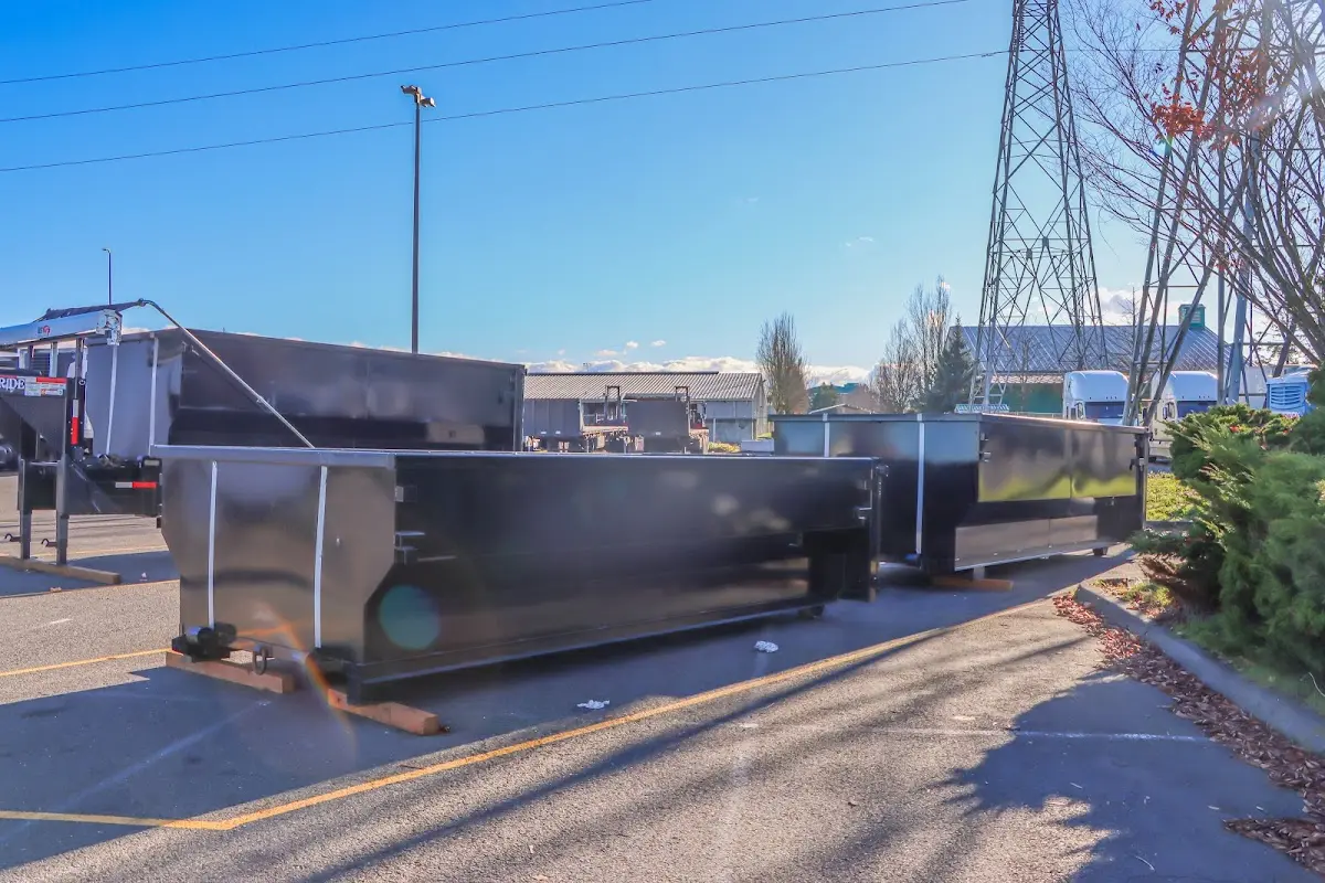 Roll-off dumpster ready for waste disposal at job site for 2 Yard Dumpster Rental in West Des Moines